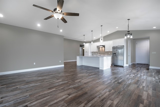 unfurnished living room with dark hardwood / wood-style flooring, vaulted ceiling, and ceiling fan