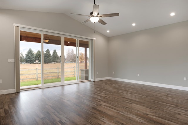 empty room with ceiling fan, dark hardwood / wood-style flooring, and lofted ceiling