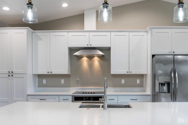 309 Kari Ln, Polson, MT 59860 - kitchen with stainless steel fridge with ice dispenser, a sink, recessed lighting, lofted ceiling, and pendant lighting
