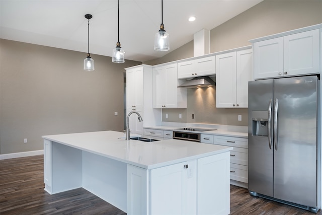 kitchen with sink, stainless steel fridge with ice dispenser, pendant lighting, vaulted ceiling, and white cabinets