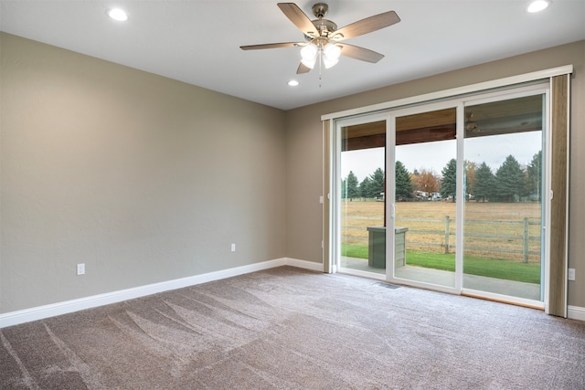 unfurnished room with carpet and ceiling fan