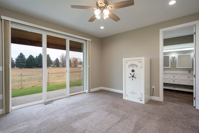 unfurnished bedroom featuring carpet flooring, ceiling fan, access to outside, and connected bathroom