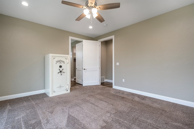 unfurnished bedroom featuring ceiling fan and carpet