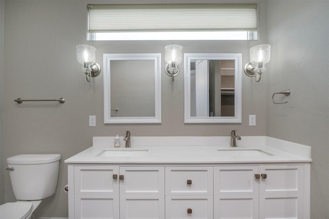 309 Kari Ln, Polson, MT 59860 - bathroom with plenty of natural light, toilet, and double vanity