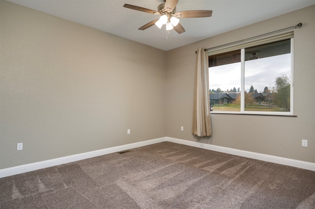 unfurnished room with ceiling fan and carpet floors