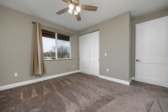 unfurnished bedroom featuring carpet flooring, ceiling fan, and a closet