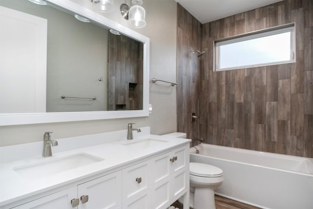 309 Kari Ln, Polson, MT 59860 - full bath with toilet, shower / bathtub combination, double vanity, and wood finished floors