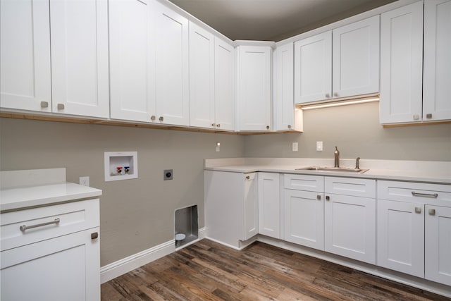 laundry area with cabinets, dark wood-type flooring, sink, hookup for a washing machine, and hookup for an electric dryer