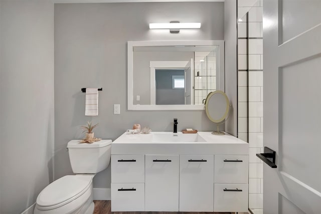 bathroom featuring hardwood / wood-style floors, vanity, and toilet