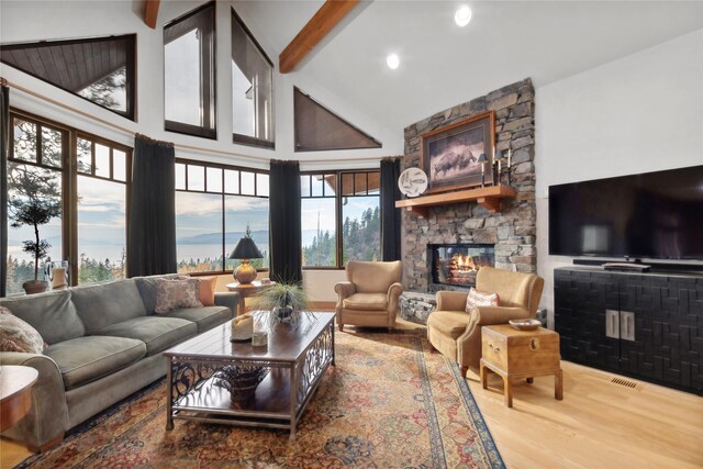 32054 Birch Tree Dr, Bigfork, MT 59911 - living room with beam ceiling, recessed lighting, light wood finished floors, and high vaulted ceiling
