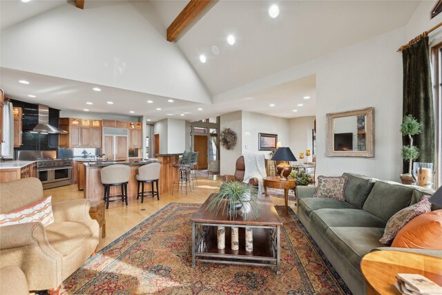 32054 Birch Tree Dr, Bigfork, MT 59911 - dining area with light wood finished floors, recessed lighting, a stone fireplace, and vaulted ceiling