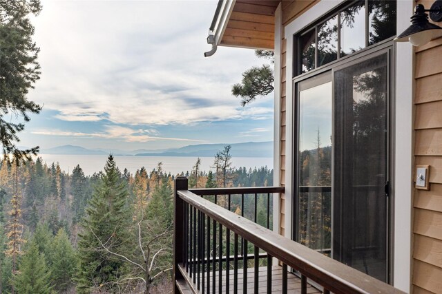 32054 Birch Tree Dr, Bigfork, MT 59911 - wooden terrace featuring outdoor dining area