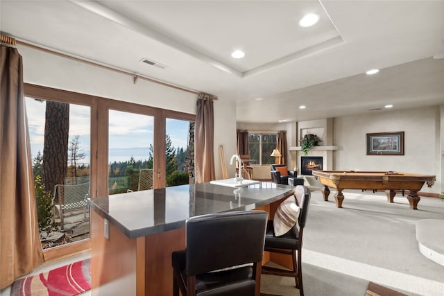 interior space featuring a raised ceiling and pool table