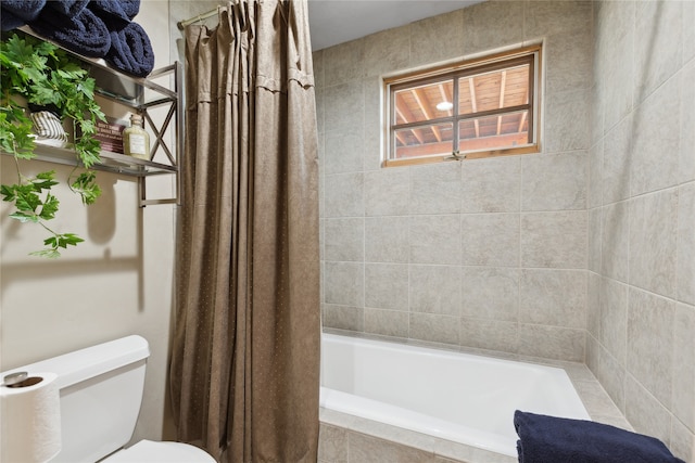 bathroom with toilet and shower / tub combo with curtain