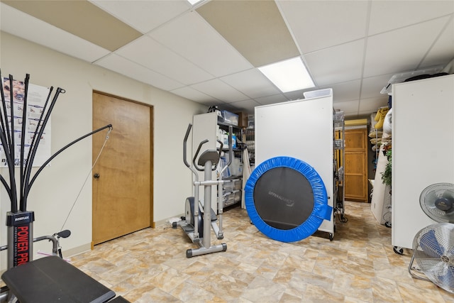 workout room featuring a drop ceiling