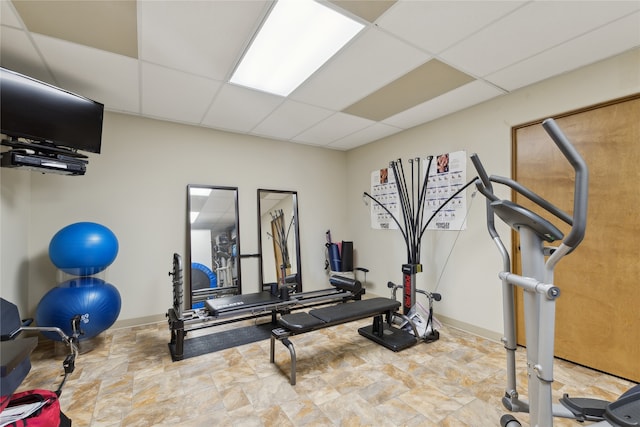 workout area with a paneled ceiling