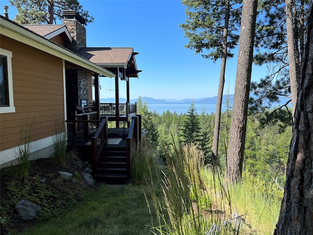 wooden deck featuring a mountain view