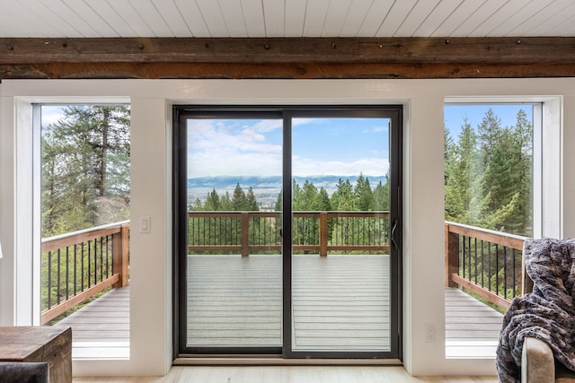 469 Owings Creek Loop, Hamilton, MT 59840 - doorway to outside featuring wood finished floors and a wood ceiling with exposed beams