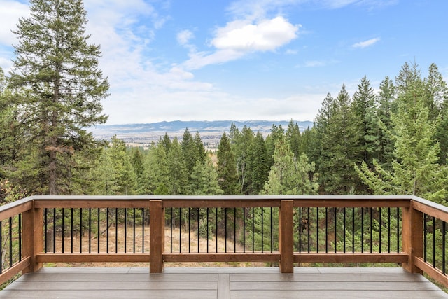 wooden deck with a mountain view