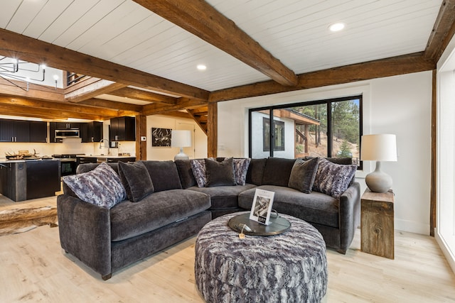 469 Owings Creek Loop, Hamilton, MT 59840 - living area featuring light wood-type flooring, beamed ceiling, and recessed lighting