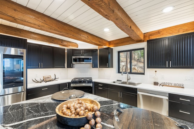 kitchen featuring beamed ceiling, stainless steel appliances, wooden ceiling, and sink