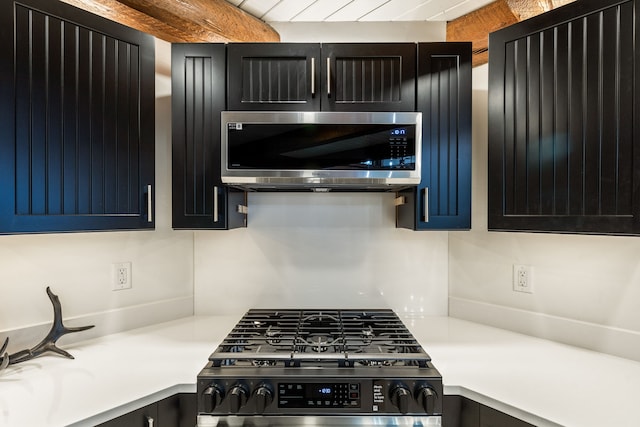 469 Owings Creek Loop, Hamilton, MT 59840 - kitchen featuring appliances with stainless steel finishes, light countertops, and dark cabinetry