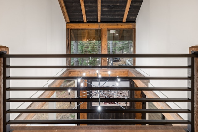 stairway featuring vaulted ceiling with beams and wood ceiling