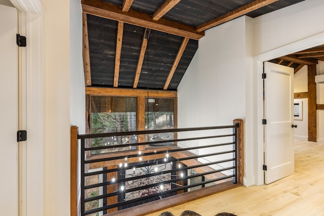 corridor with wooden ceiling, lofted ceiling with beams, and wood-type flooring