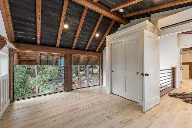 469 Owings Creek Loop, Hamilton, MT 59840 - interior space featuring a wall mounted air conditioner, wood finished floors, and wooden ceiling