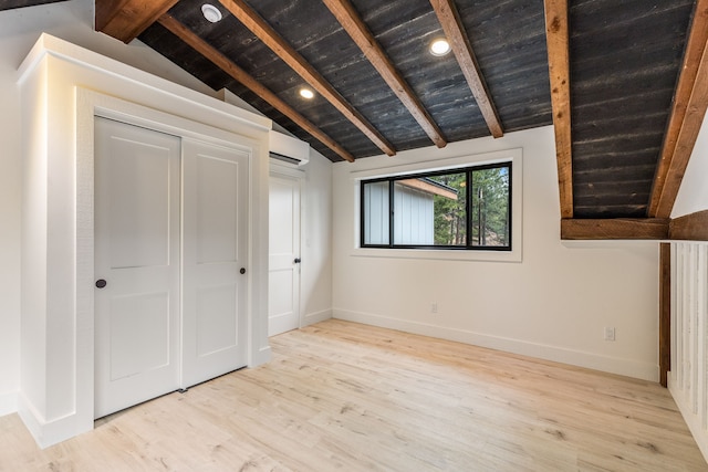 469 Owings Creek Loop, Hamilton, MT 59840 - unfurnished bedroom featuring wood finished floors, an AC wall unit, wood ceiling, and a closet