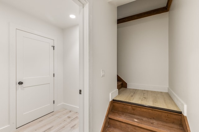 stairway featuring hardwood / wood-style flooring