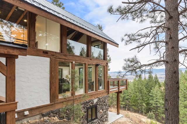 view of side of home featuring a mountain view