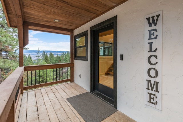 wooden deck with a mountain view