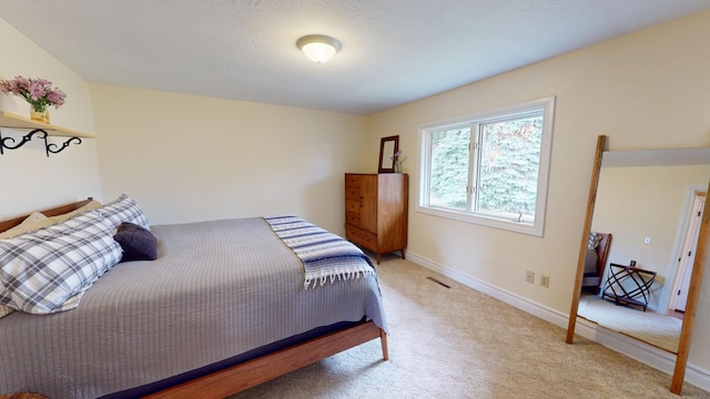 bedroom with light carpet