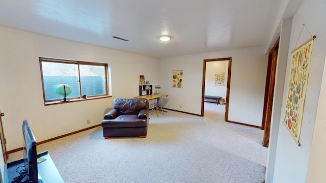 living area with carpet flooring