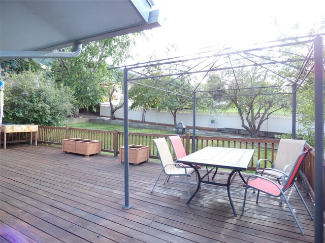 wooden terrace with a yard