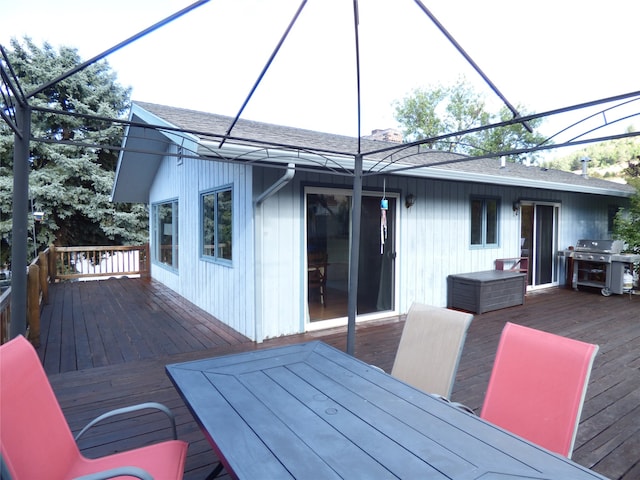 wooden terrace featuring grilling area