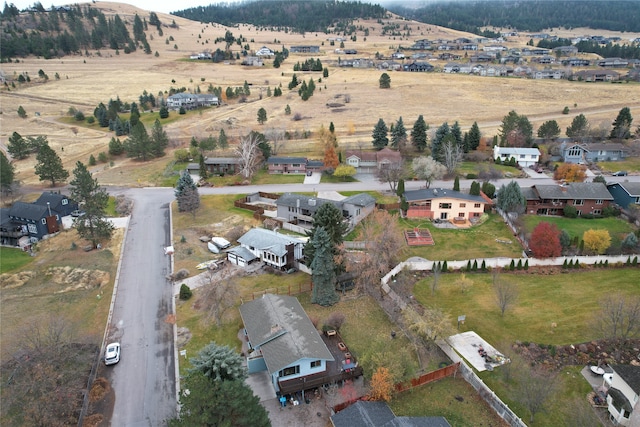 birds eye view of property with a rural view