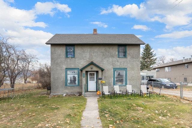 view of front of house featuring a front lawn