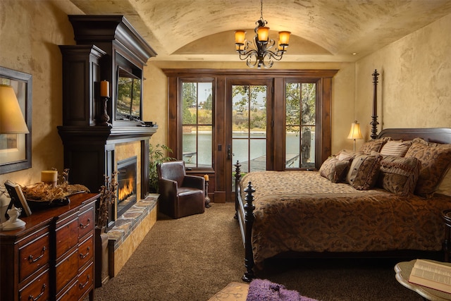 carpeted bedroom with a chandelier, access to outside, and lofted ceiling