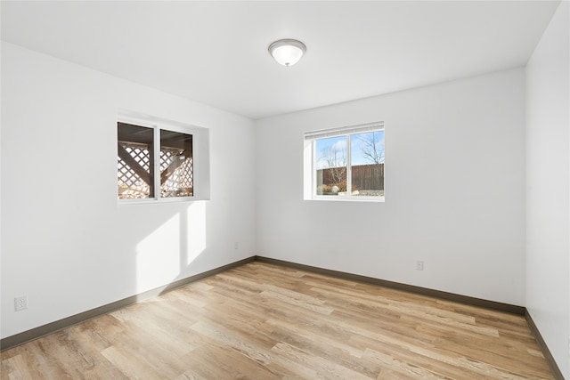 unfurnished room featuring light hardwood / wood-style floors