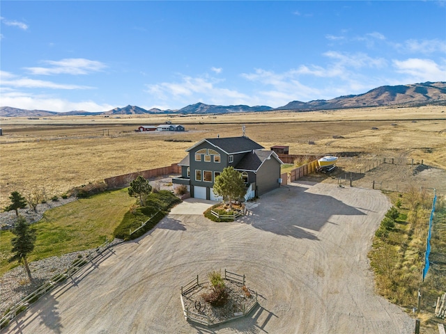 aerial view with a mountain view and a rural view