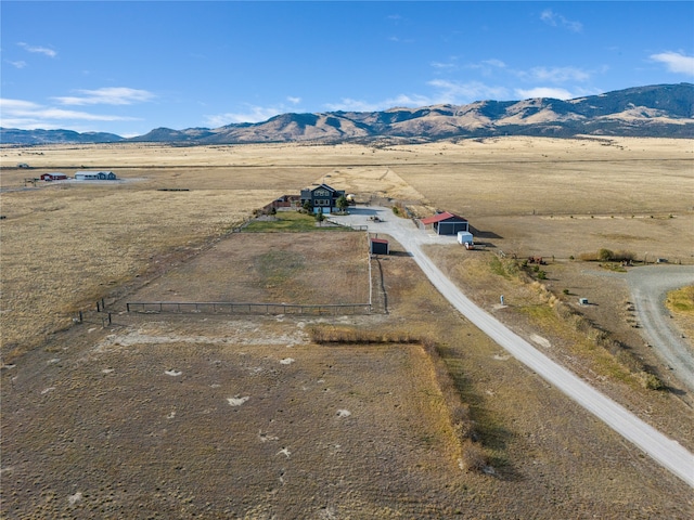 drone / aerial view featuring a mountain view and a rural view