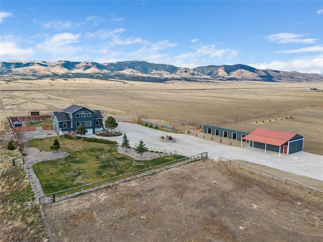 drone / aerial view with a mountain view and a rural view