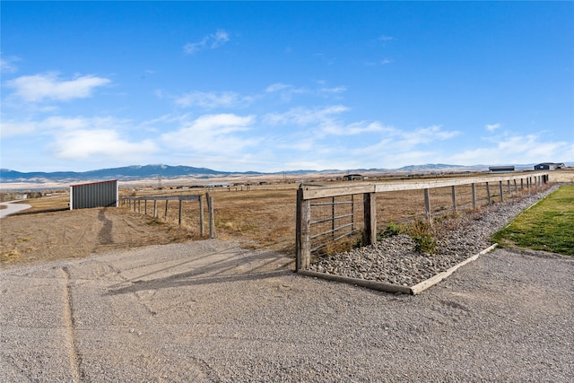 view of yard featuring a mountain view and a rural view