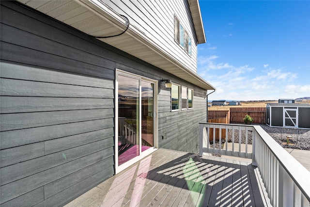 wooden deck featuring a storage shed