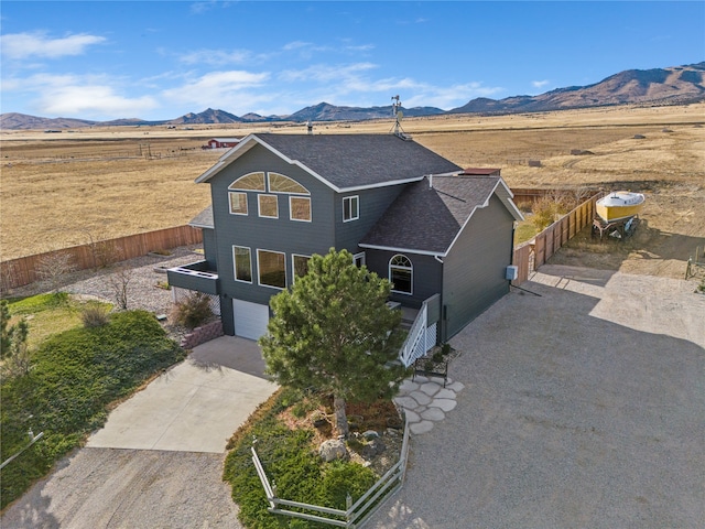 view of front of home featuring a mountain view and a garage