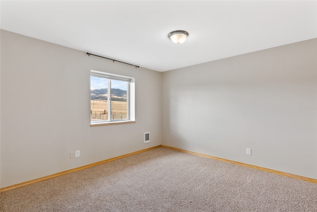 spare room featuring carpet flooring