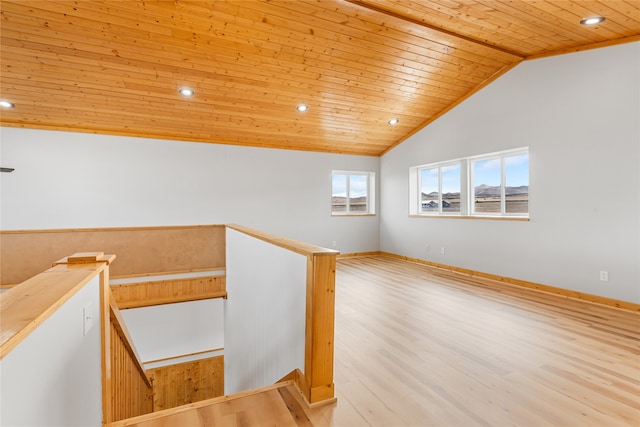 interior space with light wood-type flooring, lofted ceiling, and wood ceiling