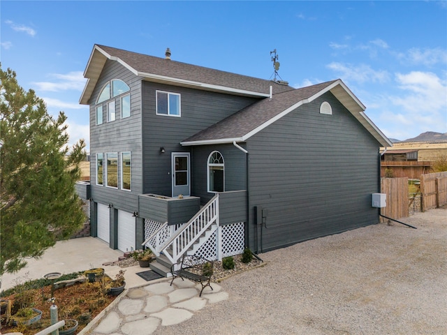 back of house with a garage